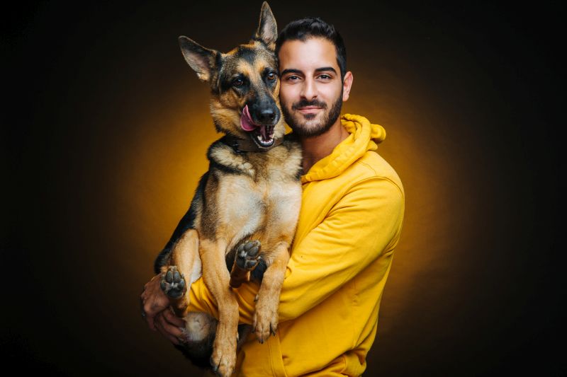 Ben Avital Dog trainer holding dog
